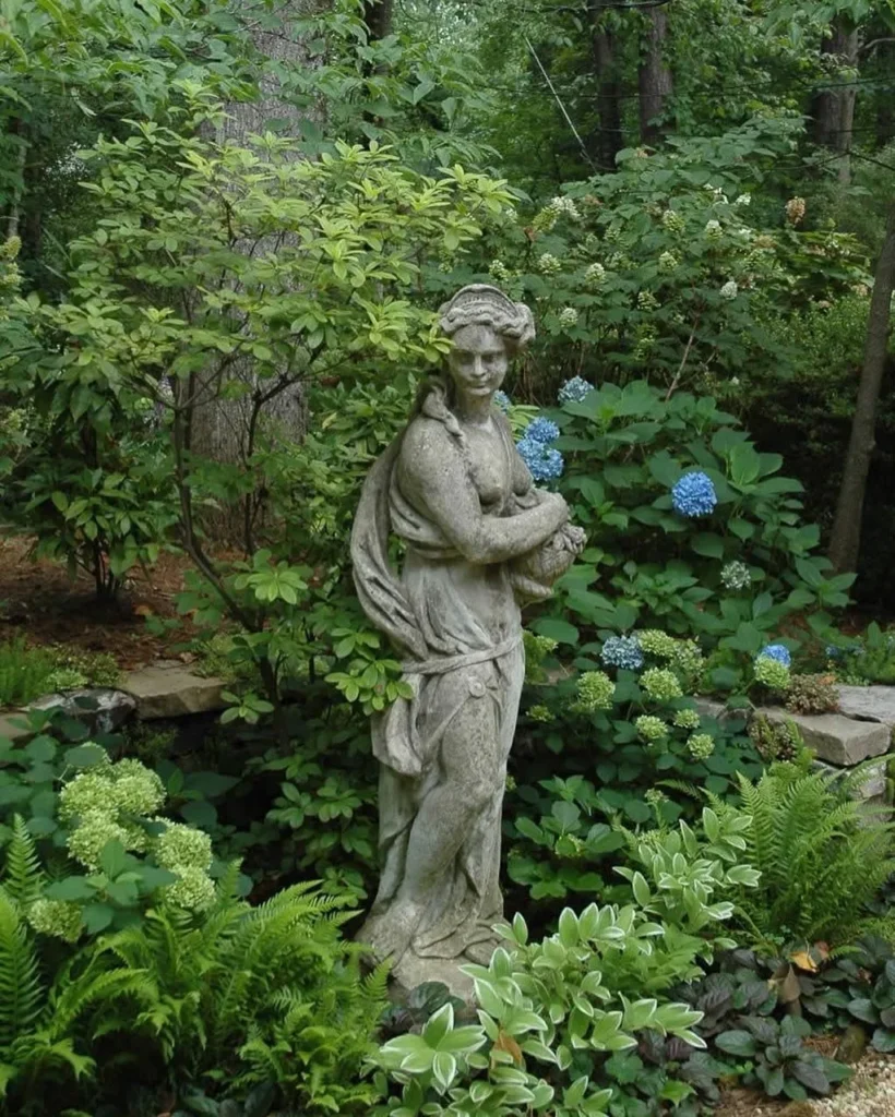 Graceful Garden Statue Amidst Lush Foliage
